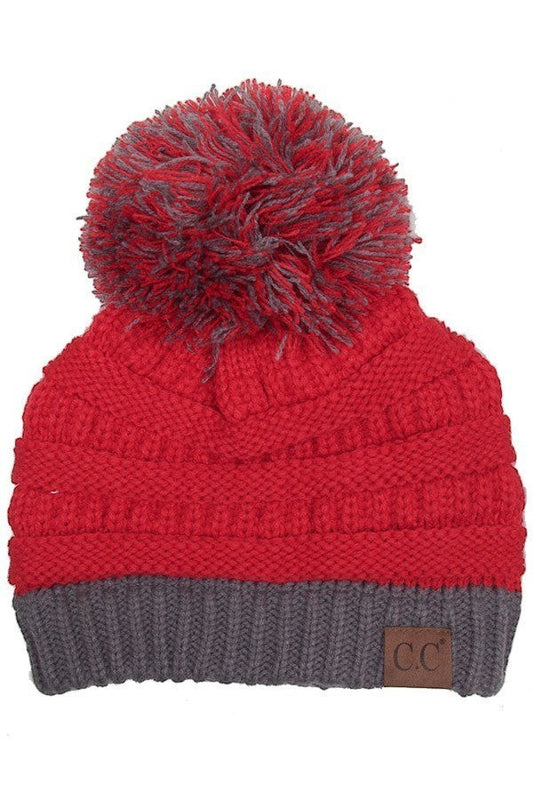 Allen's Bootery red and grey knit beanie with a matching multi-colored pom pom and a brown logo patch.