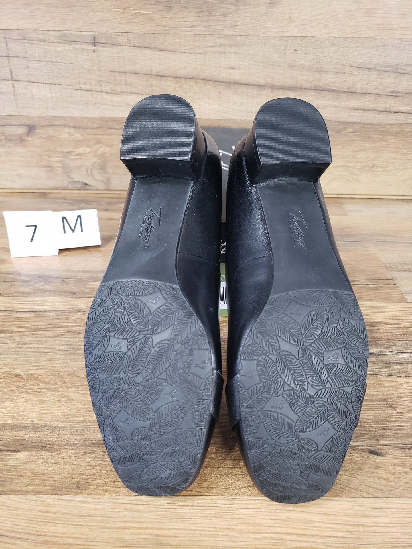 Allen's Bootery Trotters Doris Signature black dress shoes showing the textured rubber soles and low block heels