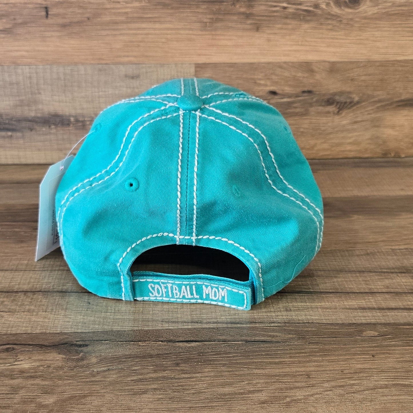 Allen's Bootery turquoise distressed cotton baseball cap with Softball Mom text on the adjustable back strap
