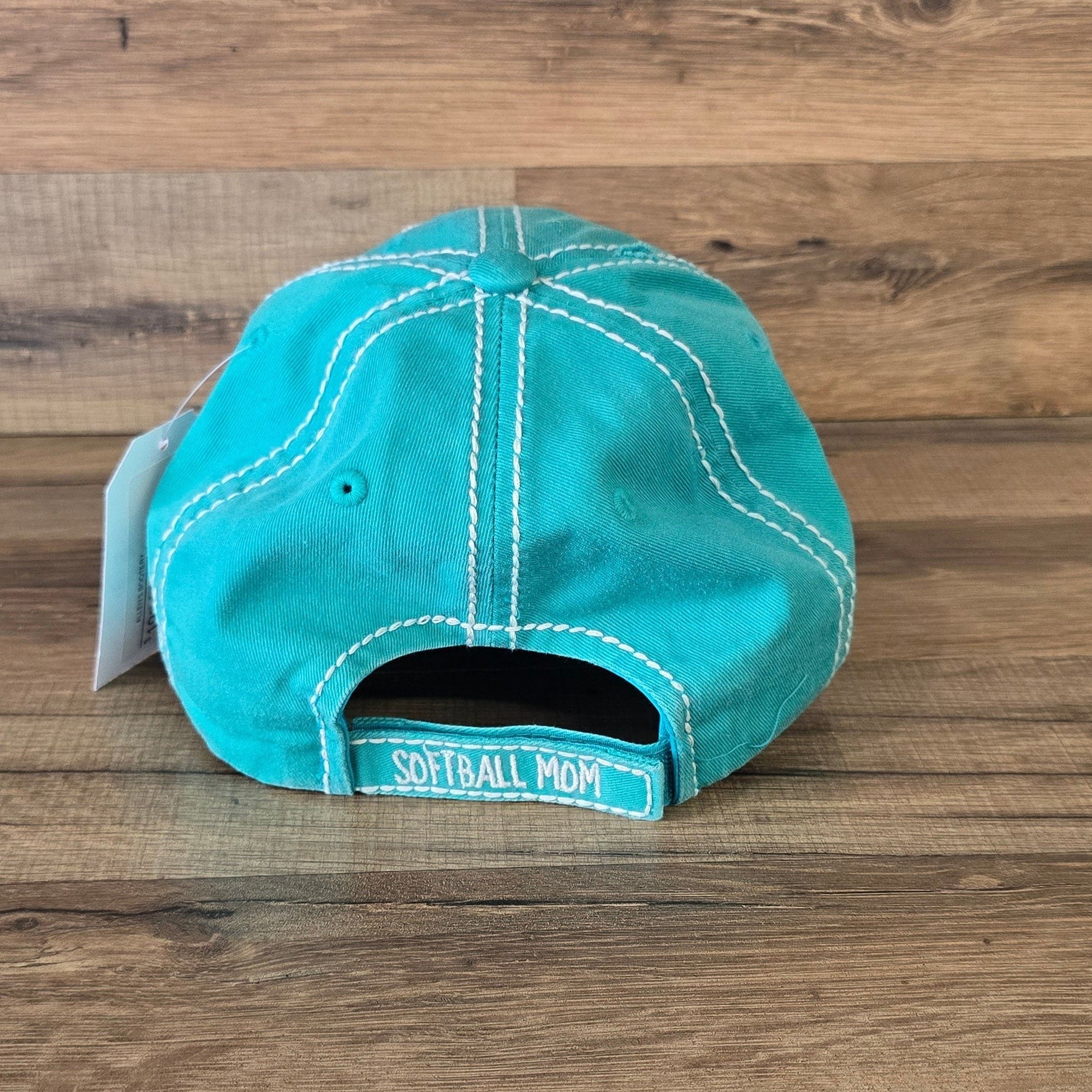 Allen's Bootery turquoise distressed cotton baseball cap with Softball Mom text on the adjustable back strap
