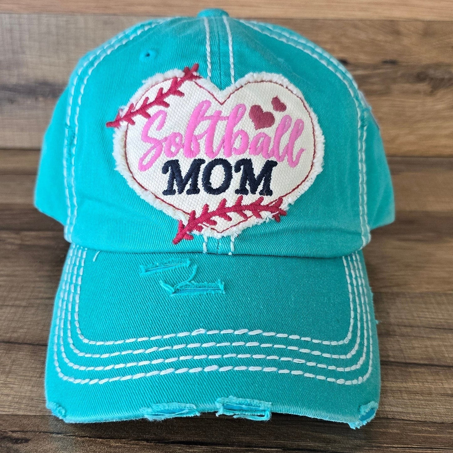 Allen's Bootery turquoise distressed cotton baseball cap with an embroidered heart-shaped softball mom patch.
