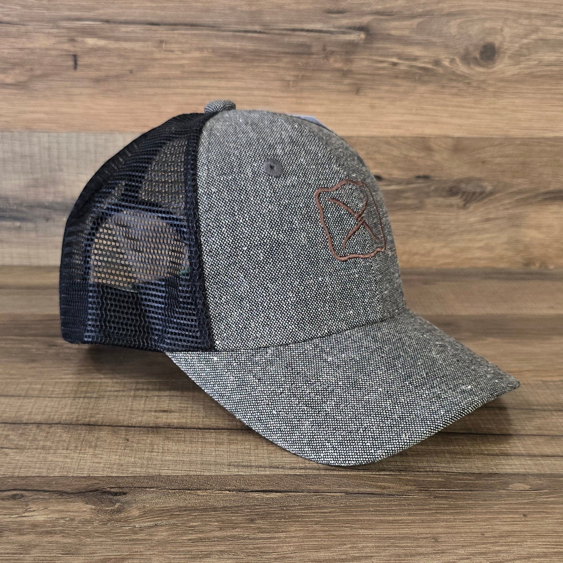 Allen's Bootery Twisted X trucker hat in charcoal tweed with a black mesh back and brown embroidered logo