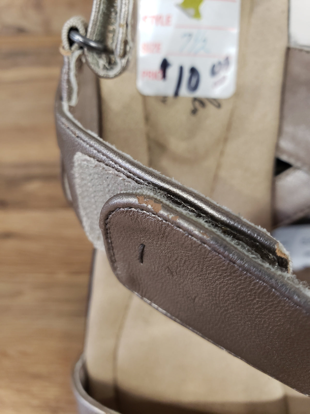 Allen's Bootery Wela pewter wedge sandal featuring a velcro closure strap with visible wear on the edge