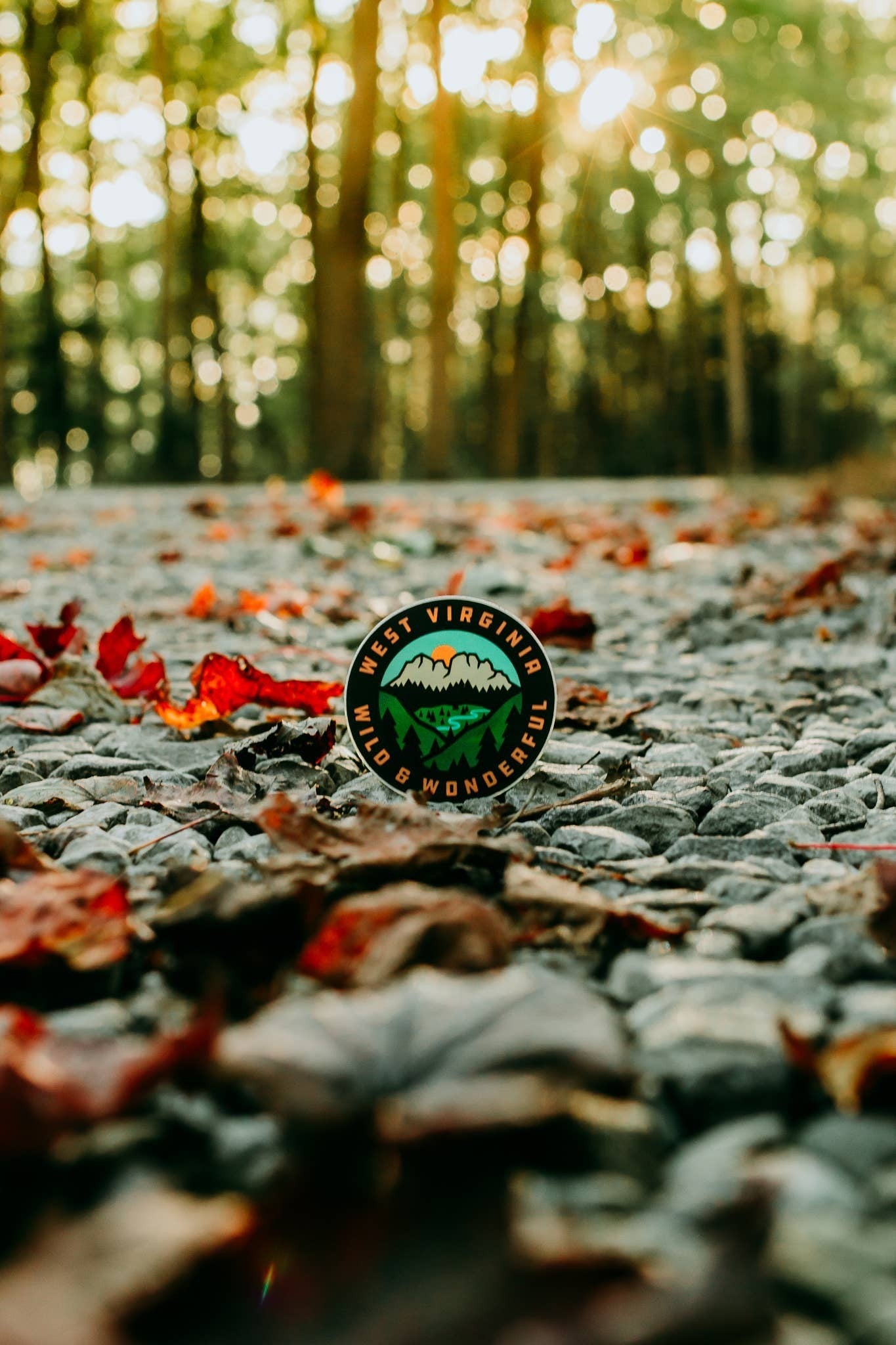 Allen's Bootery circular West Virginia scenery sticker featuring Seneca Rocks on a gravel path with autumn leaves.