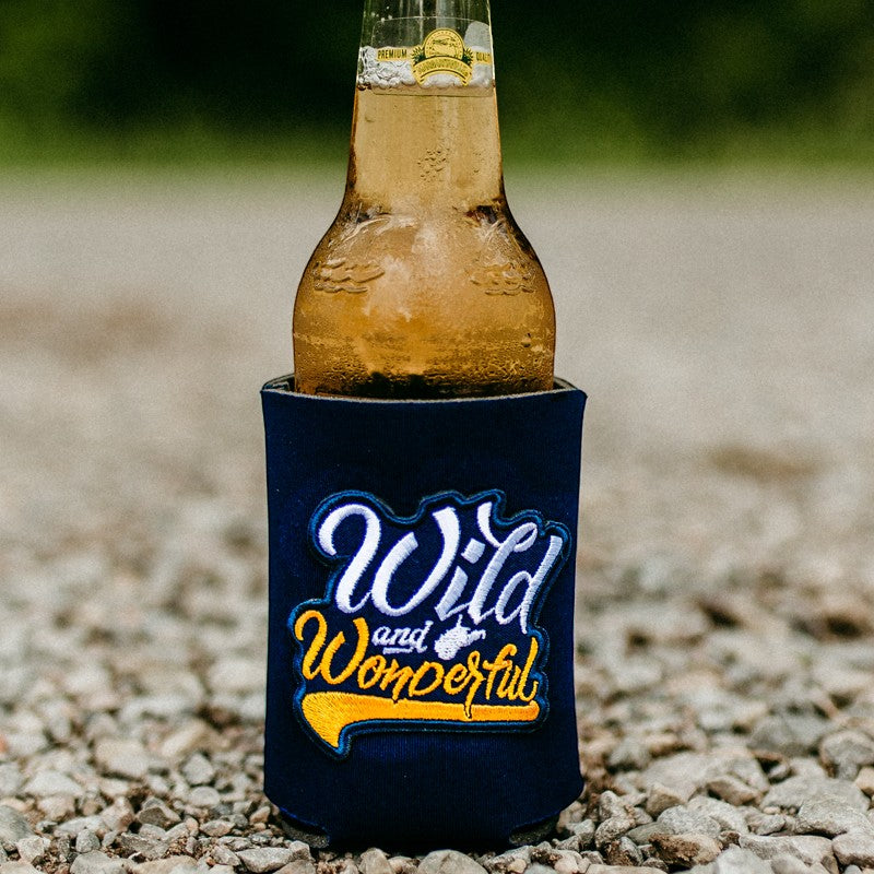 Allen's Bootery navy blue can cooler featuring a Wild and Wonderful embroidered patch holding a glass beer bottle