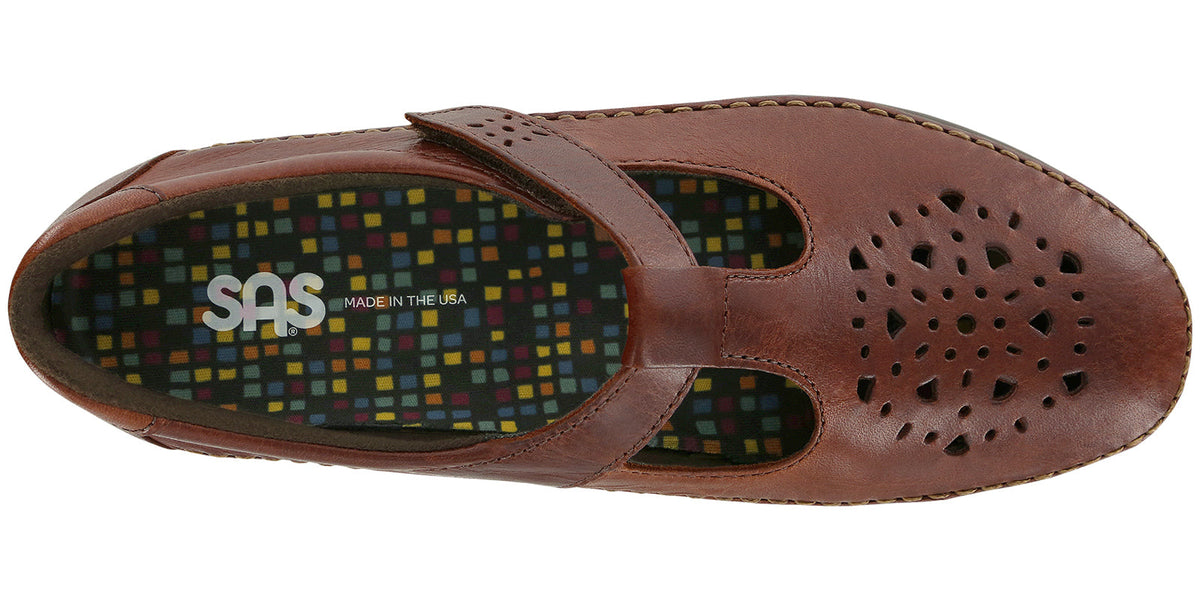 Allen's Bootery Willow walnut leather moccasin with cutout pattern, adjustable strap, and cushioned footbed.