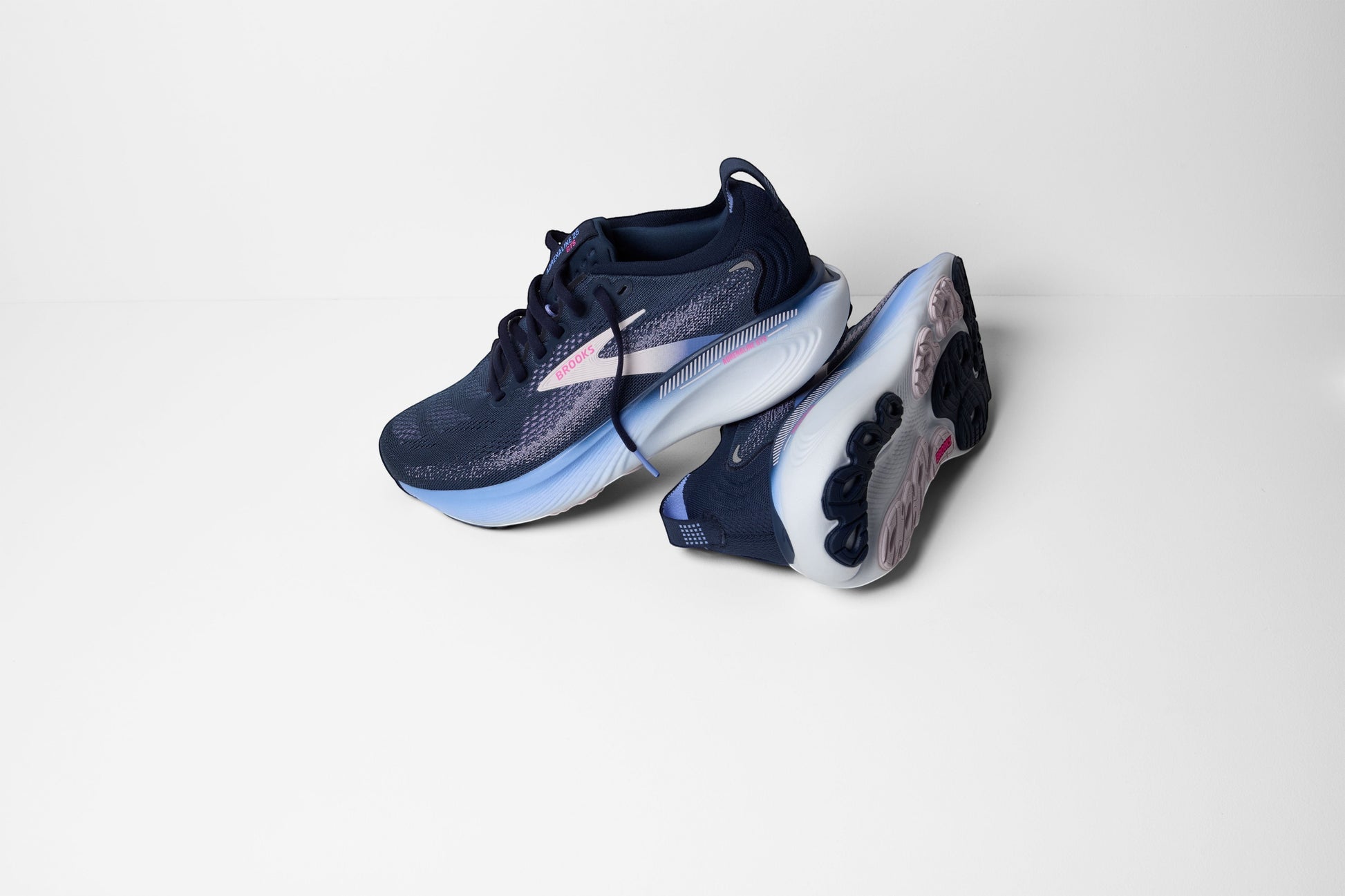Allen's Bootery Women's Adrenaline 25 navy running shoes with pink and light blue accents. Breathable mesh upper and cushioned sole.