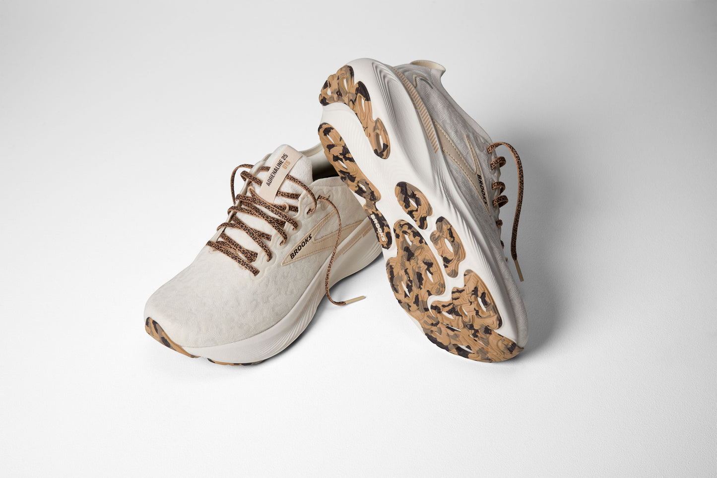 Allen's Bootery Women's Adrenaline 25 running shoes in coconut and tofu colors with a unique camouflage sole.