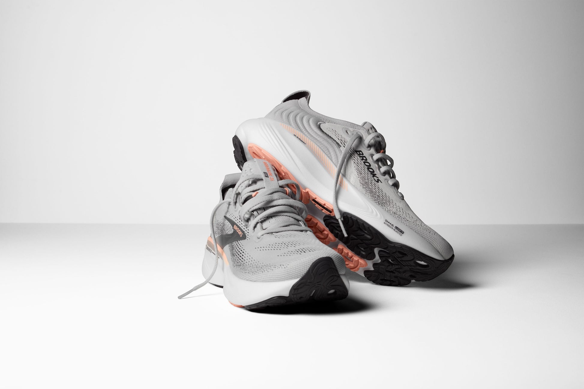 Allen's Bootery Women's Adrenaline GTS 25 grey, black, and coral running shoes with breathable mesh upper and supportive cushioning.