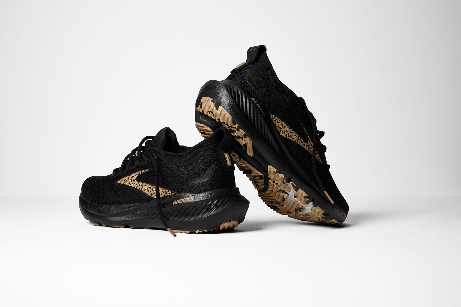 Allen's Bootery Women's Glycerin 23 black running shoes with leopard print accents and tan soles.