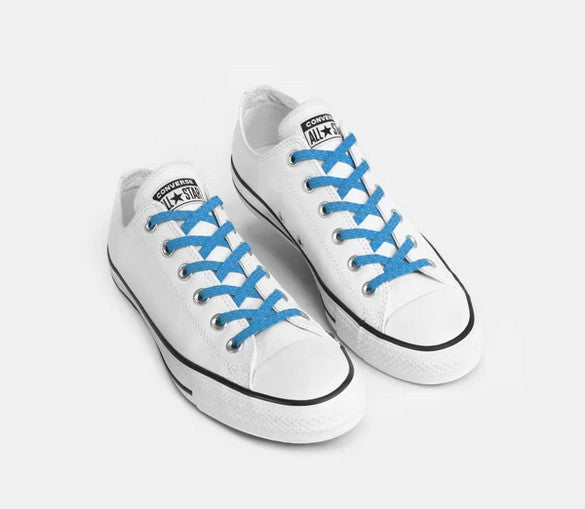 Allen's Bootery Xpand no-tie reflective blue elastic laces installed on white low-top canvas sneakers