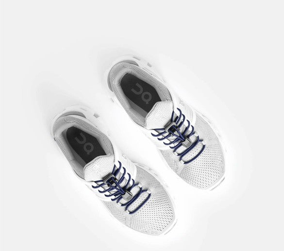 Allen's Bootery Xpand navy blue elastic quick release laces installed on white athletic sneakers