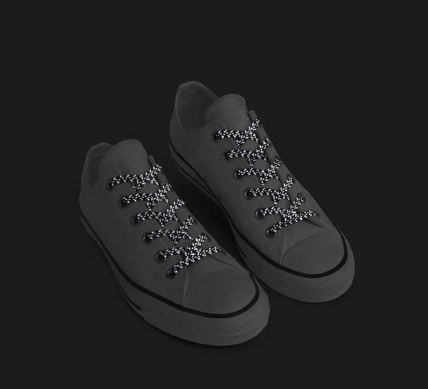 Allen's Bootery Xpand Laces navy blue reflective no-tie elastic laces installed on casual sneakers