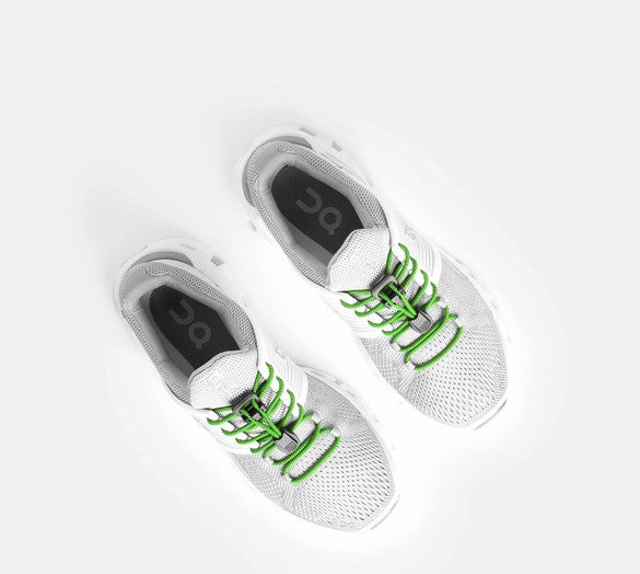 Allen's Bootery Xpand neon green elastic quick-release laces installed on white running shoes