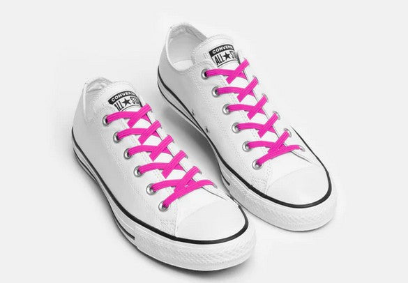 Allen's Bootery Xpand neon pink elastic no-tie laces installed on white low-top canvas sneakers