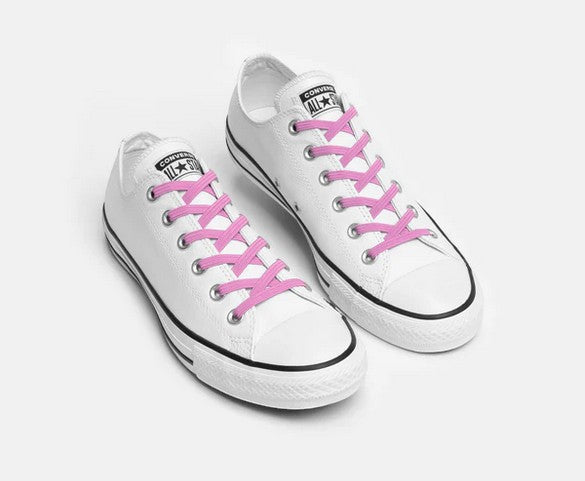 Allen's Bootery Xpand soft pink elastic no-tie laces installed on white low-top sneakers