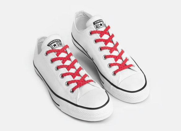 Allen's Bootery Xpand red reflective no-tie elastic laces installed on white low-top sneakers