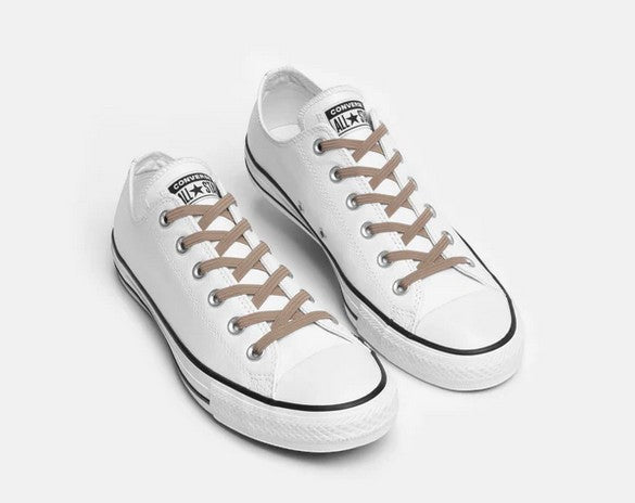 Allen's Bootery Xpand Laces Original no-tie elastic shoelaces in sand colour installed on white low-top sneakers.